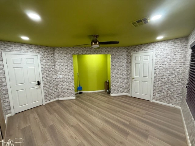 TrueStyle wallpaper installer carefully applying wall covering in Santa Monica